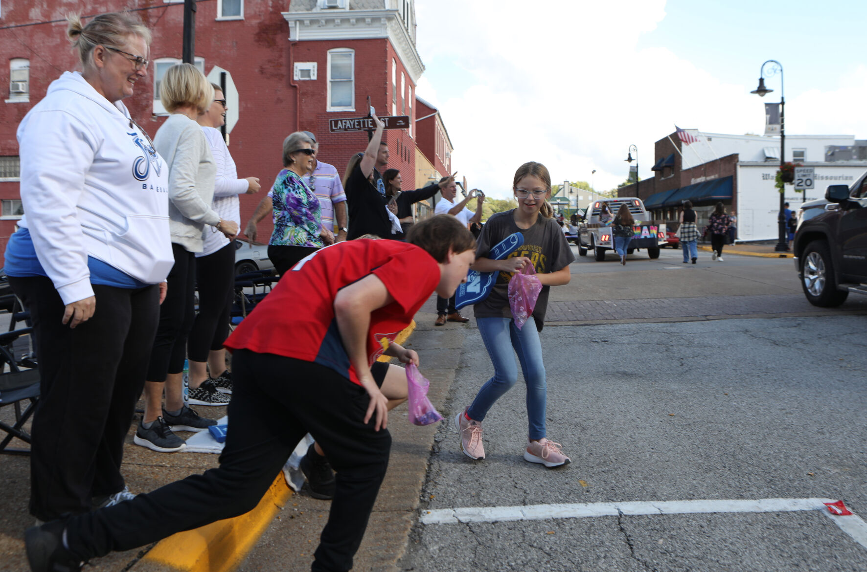 Payton Deckard and Adam Kassebaum rush for candy